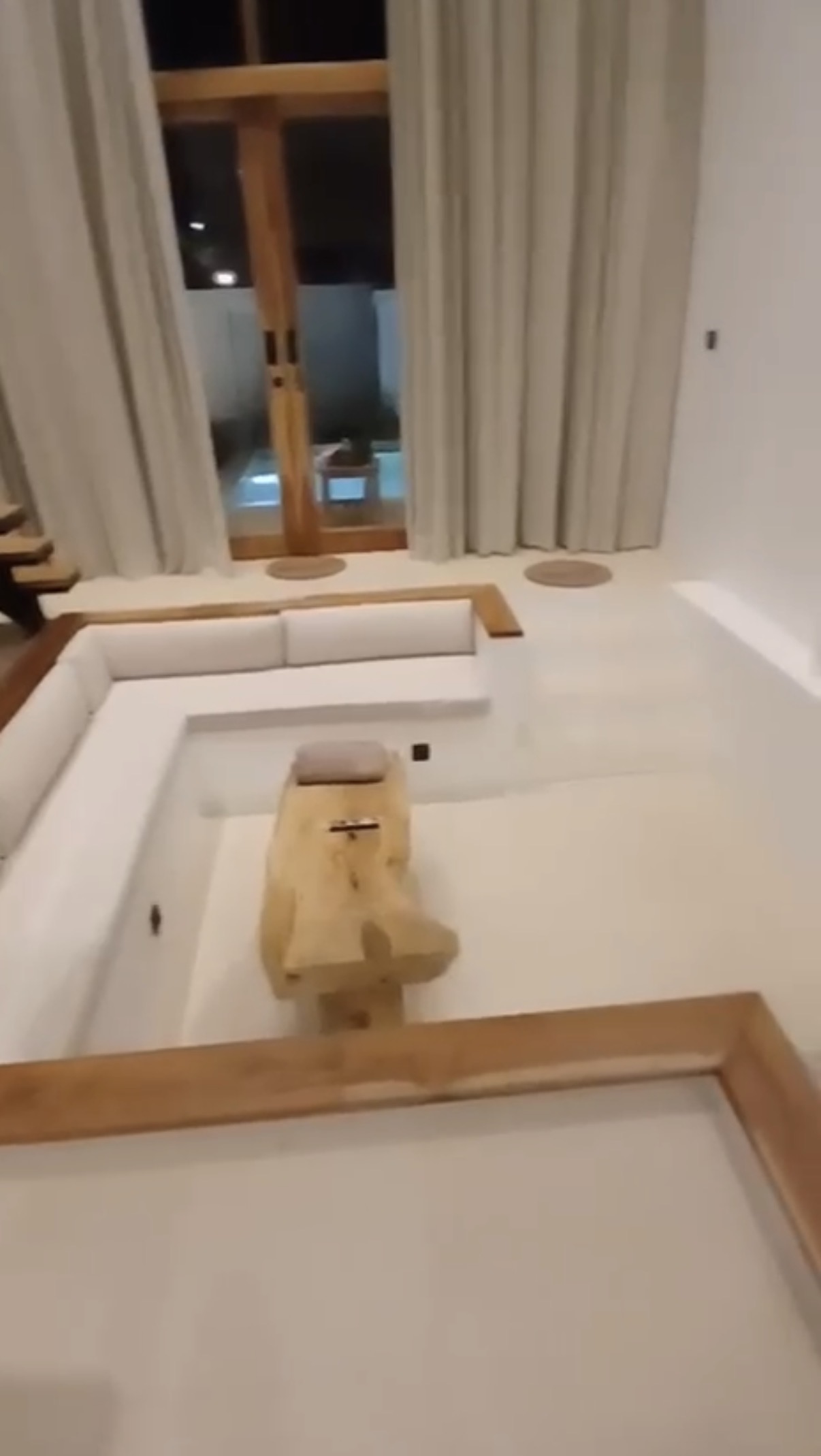 Sunken living lounge with wooden finishes
