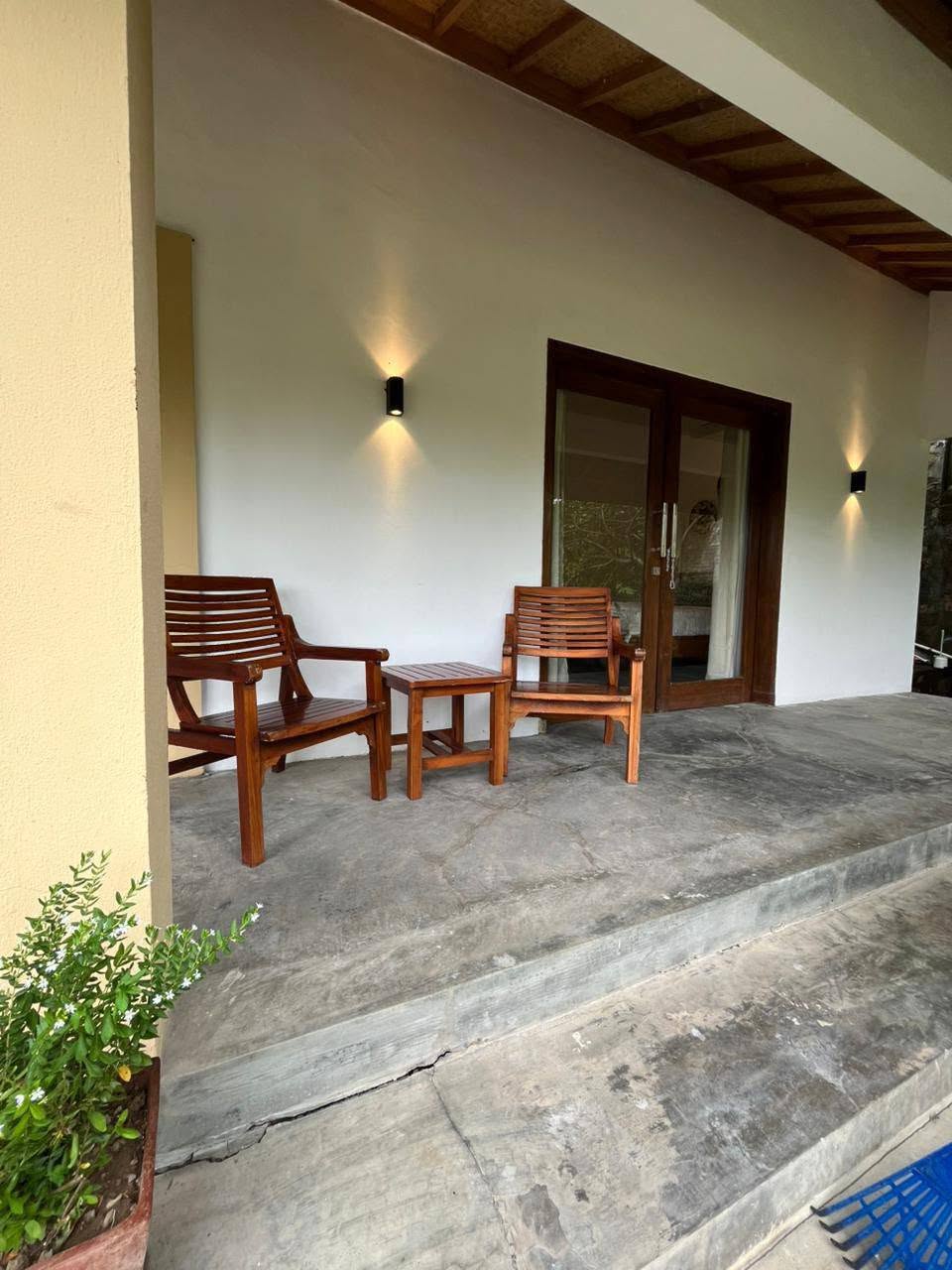 Outdoor covered terrace with wooden seating