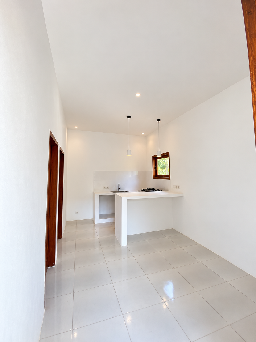Unfurnished open-plan kitchen and living area