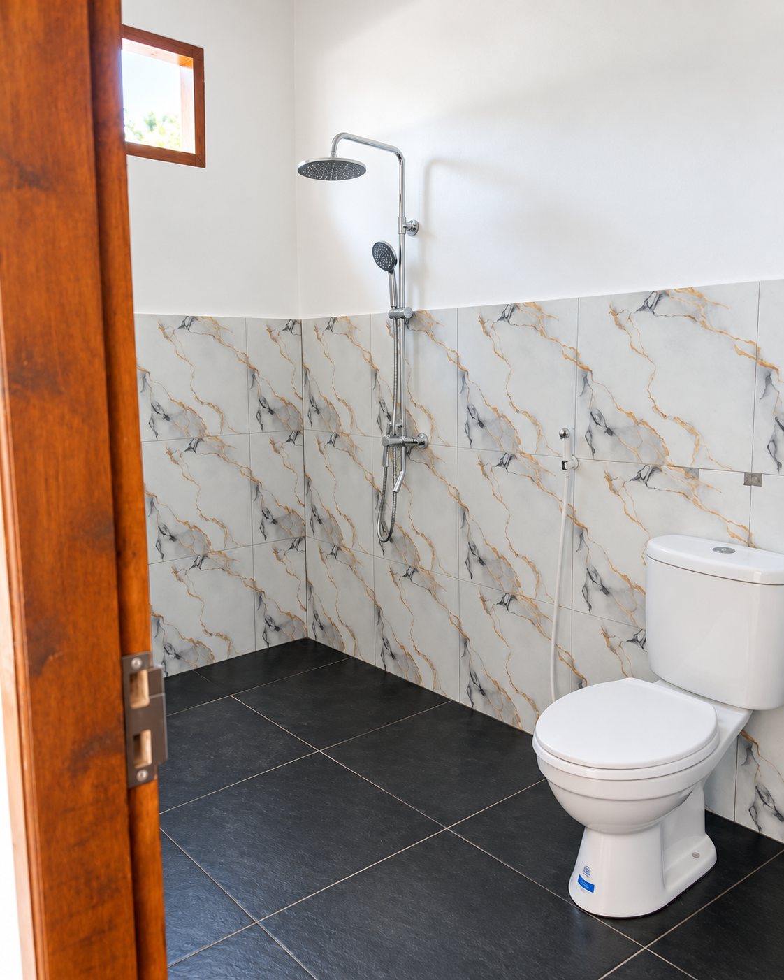 Private bathroom with modern rainfall shower, handheld shower and toilet