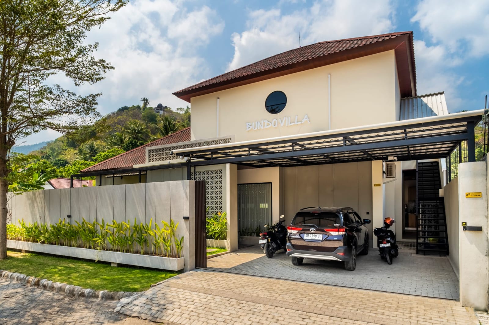 Front entrance and covered parking area of the villa