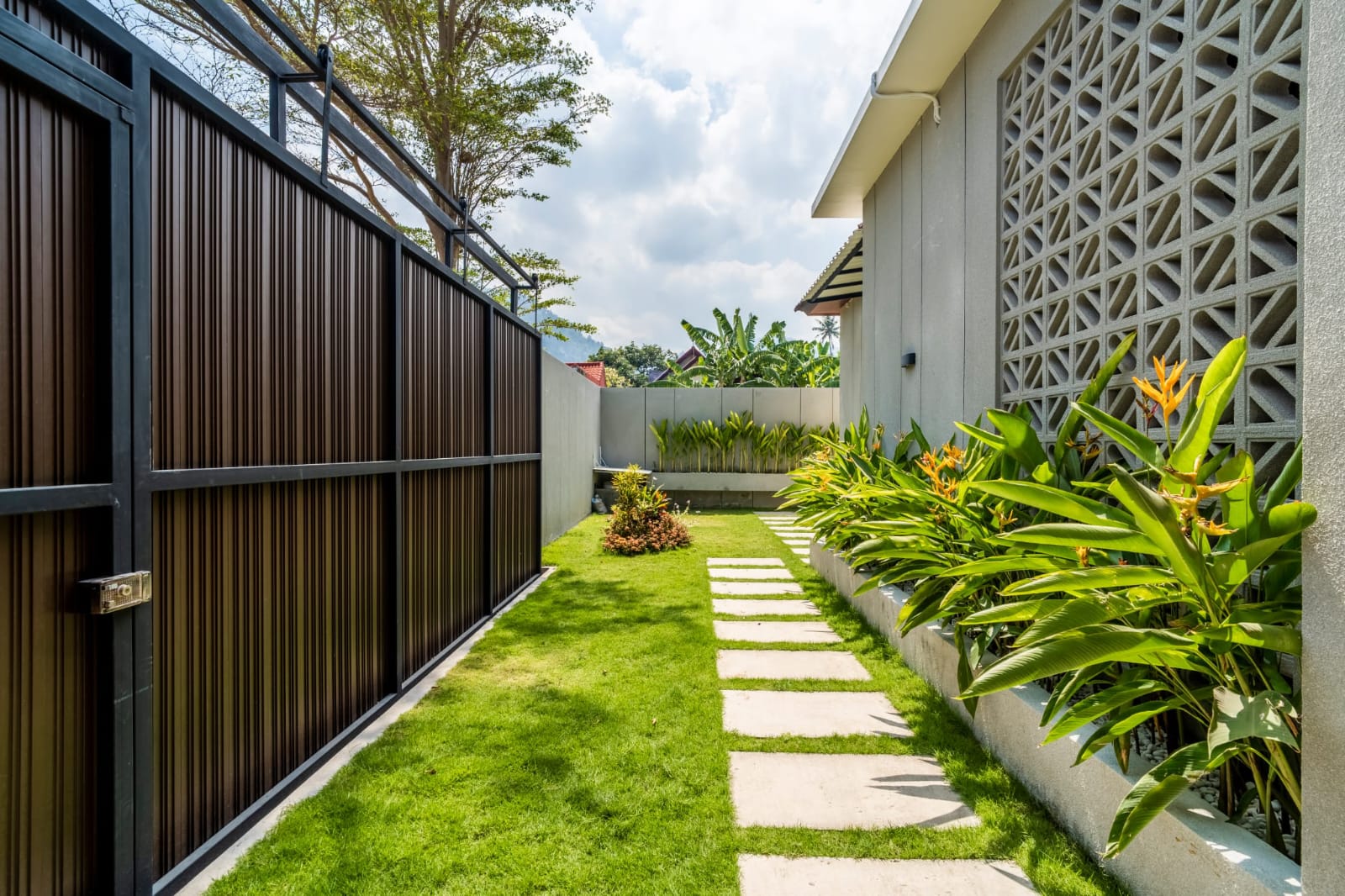Landscaped garden walkway beside the residence