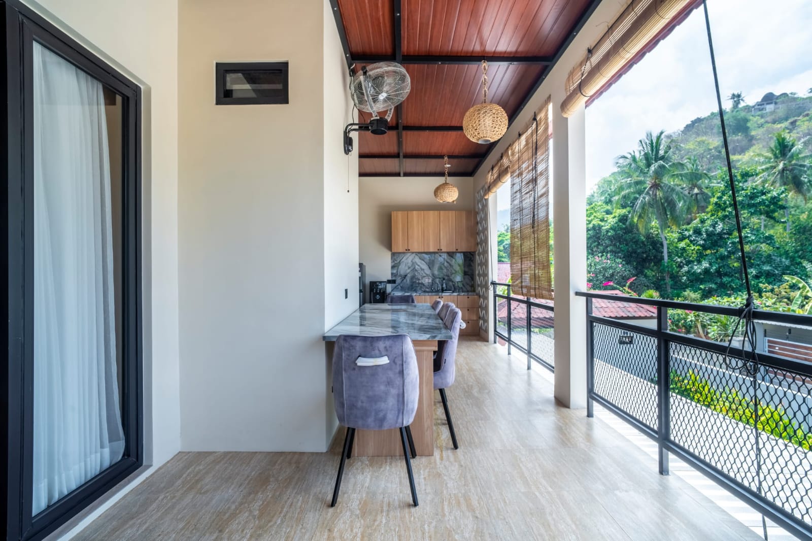 Covered upstairs outdoor dining terrace