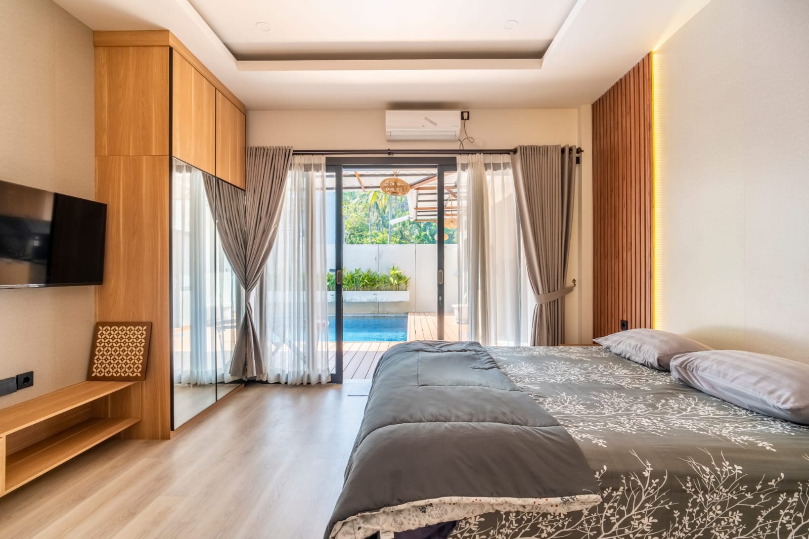 Air-conditioned furnished bedroom overlooking the pool