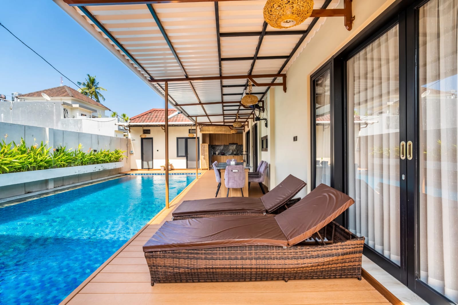 Covered pool deck with sun loungers