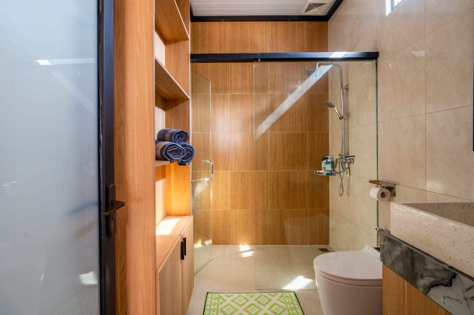 Bathroom with shower and built-in shelves