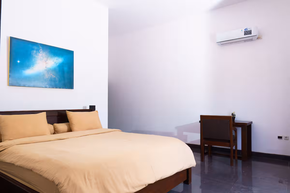 Bedroom with double bed and desk