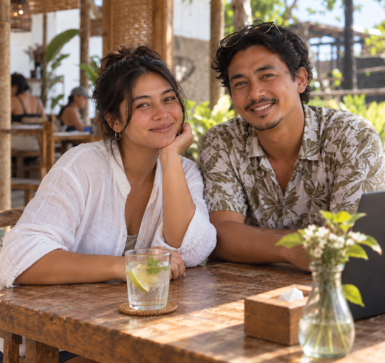 Ulan and Wahyu, the local Lombok Local team, welcoming guests at a tropical café