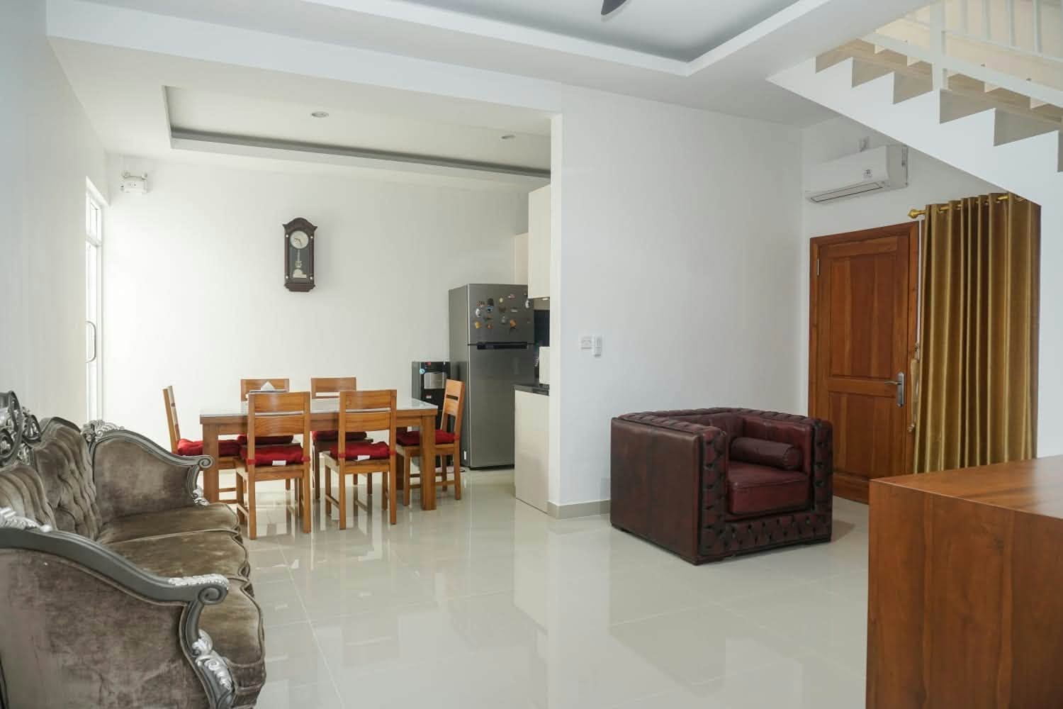 Living room, dining table and kitchenette