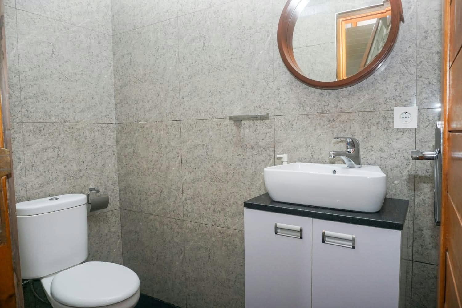 Bathroom toilet and vanity mirror